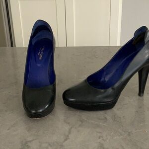 Black leather pumps